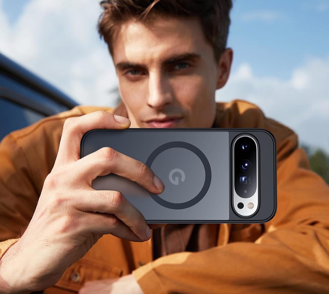 A man holding a Google Pixel in a black SPIDERCASE magnetic case